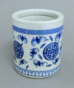 A Chinese blue and white ceramic brush pot. 12 cm high.