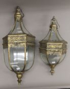 Two decorative hanging lanterns. The largest 73 cm high overall.