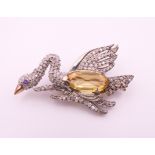 A citrine and diamond gold backed swan brooch. 4 cm wide.