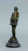 A bronze model of a singing girl. 18.5 cm high.