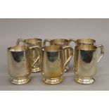 A set of six EPNS tankards. 10 cm high.