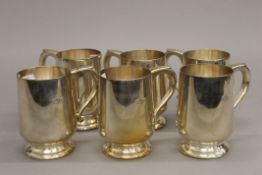 A set of six EPNS tankards. 10 cm high.