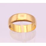 A 22 ct gold wedding band. Ring size P. 4.5 grammes.