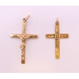Two 9 ct gold cross/crucifix pendants. The largest 3.5 cm high. 6.2 grammes.