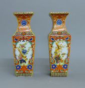A pair of Chinese coloured square porcelain vases. 25.5 cm high.