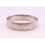 A silver bangle form bracelet. 6.5 cm internal diameter. 36 grammes.