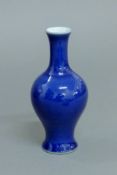 A Chinese blue ground porcelain vase. 13 cm high.