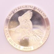 A 1oz fine silver (.999) peregrine falcon coin.
