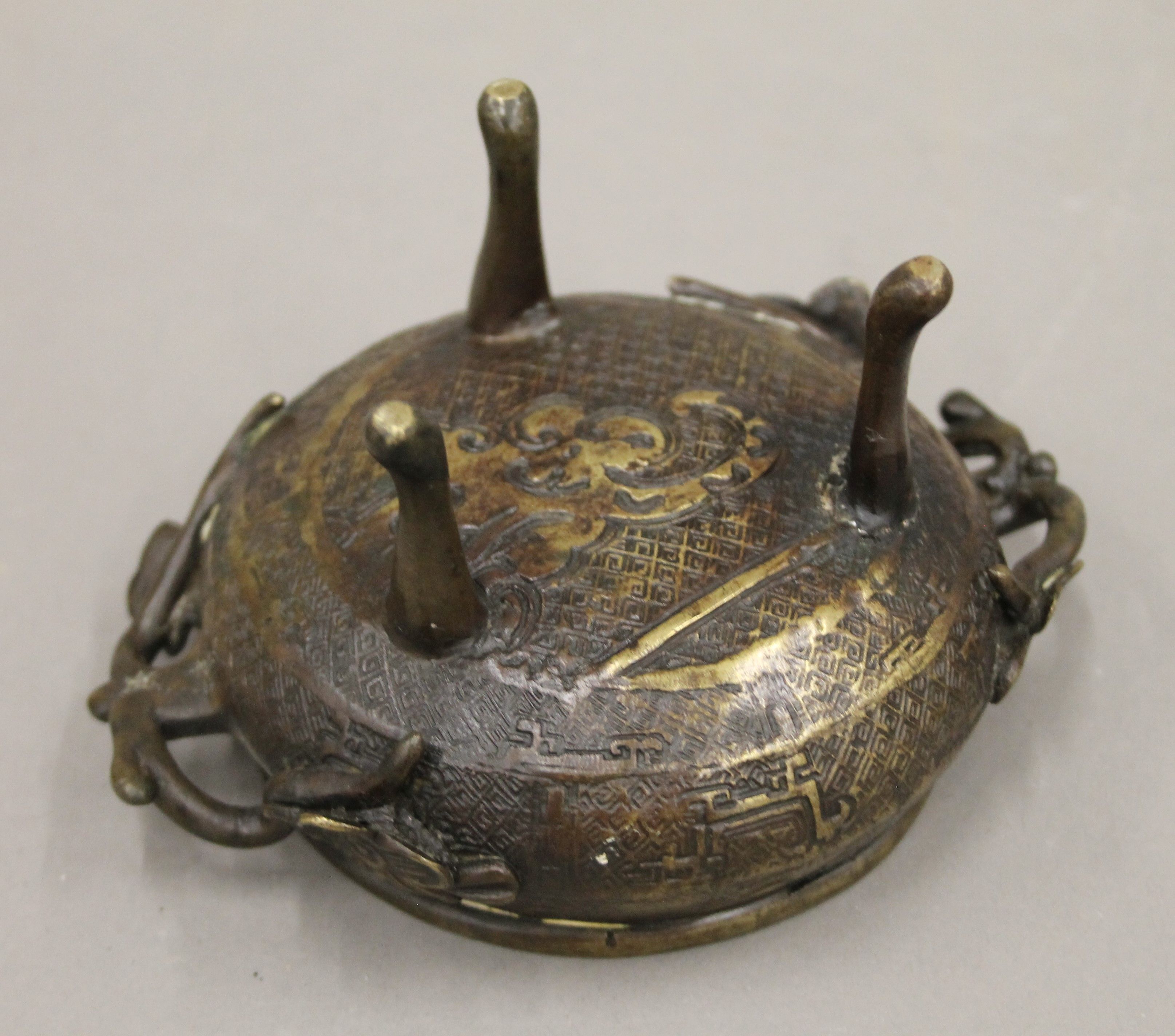 A Chinese bronze teapot with four character seal mark to base and a bronze incense burner. - Image 5 of 10