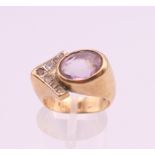 A 9 ct gold amethyst and diamond ring. Ring size I/J. 8.1 grammes total weight.