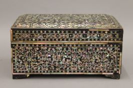 An antique Eastern mother-of-pearl inlaid casket. 23 cm wide.