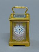 A miniature Sevres style carriage clock. 7.5 cm high overall.