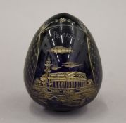 A Russian Bristol blue glass egg etched with view of St Petersburg,