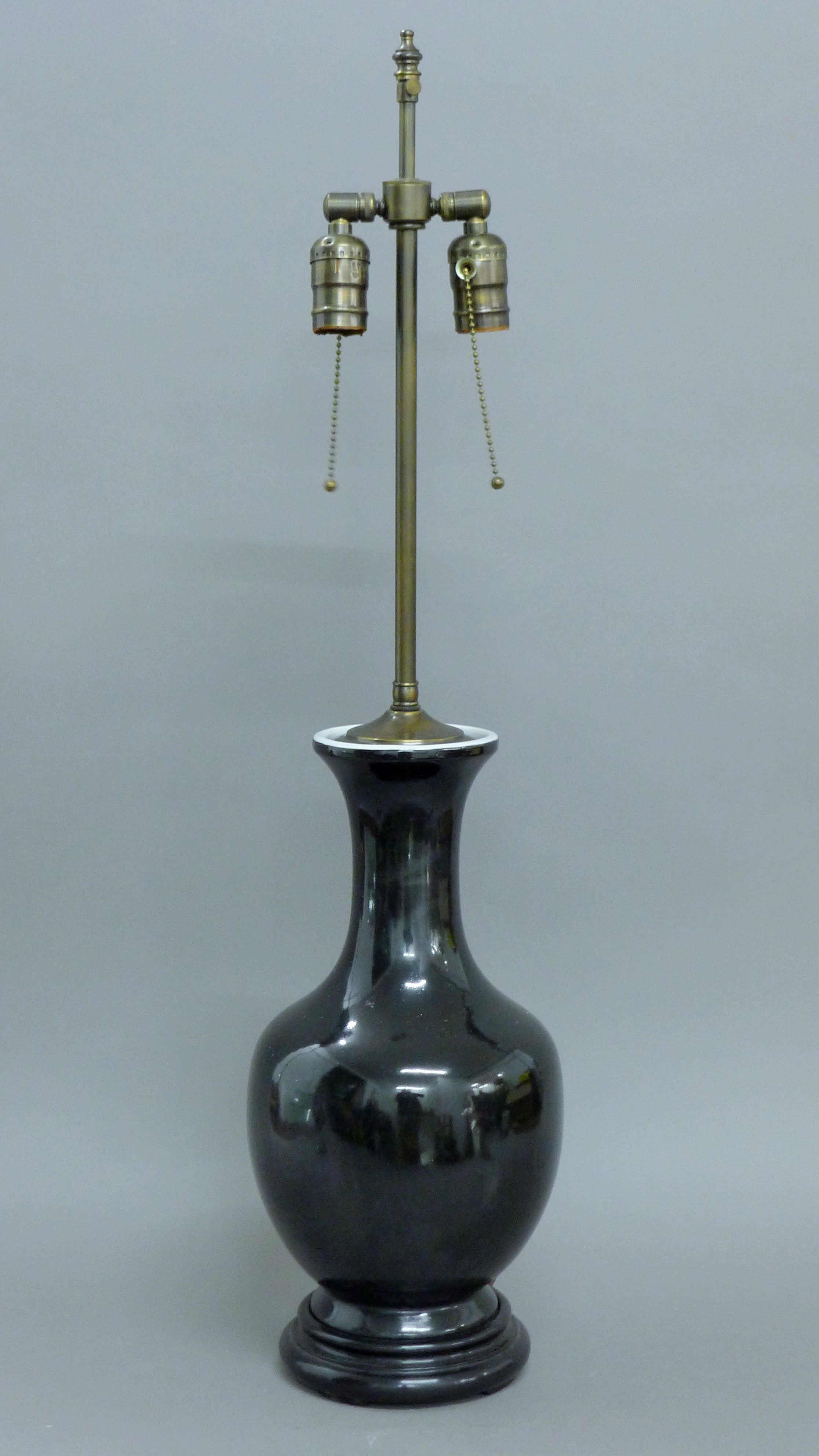 A Chinese black porcelain lamp. 81 cm high overall.