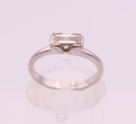 A platinum diamond solitaire ring. Ring size G/H. 3.3 grammes total weight.