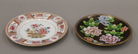 An 18th century Chinese porcelain plate and a cloisonne plate. The former 23 cm diameter.