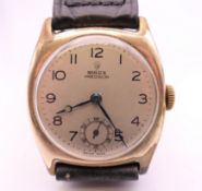 A 1935 gold plated Rolex Precision gentleman's wristwatch. 3.25 cm wide.