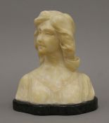 An early 20th century alabaster bust of a girl, on a marble base. 18 cm high.