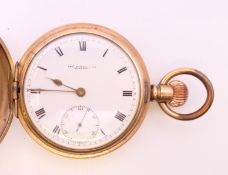 A gold plated full hunter pocket watch. 5 cm diameter.