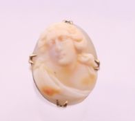 A 9 ct gold cameo ring. Ring size P. 5.8 grammes total weight.