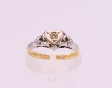 A late Victorian/Edwardian 18 ct gold and platinum heart shaped diamond ring. Ring size H. 2.