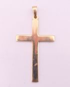 A 9 ct gold cross pendant. 4 cm high. 3.1 grammes.