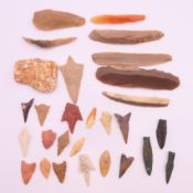 A collection of Iron and Stone Age arrowheads, etc. The largest 9.5 cm long.