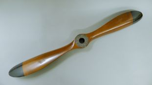 A small wooden propeller. 100 cm long.