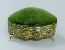 An embossed silver sewing box. 13.5 cm wide.