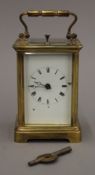 A repeating brass cased carriage clock. 15 cm high overall.