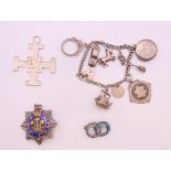 A quantity of vintage silver jewellery items including a charm bracelet,