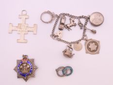 A quantity of vintage silver jewellery items including a charm bracelet,