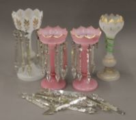 A pair of Victorian pink glass lustres and two others. The largest 34 cm high.