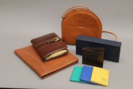 A quantity of new leather handbags.