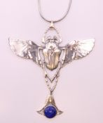 A silver scarab beetle pendant on chain. 8.5 cm wide.