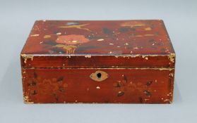 A Japanese lacquered box containing a quantity of cigarette cards.