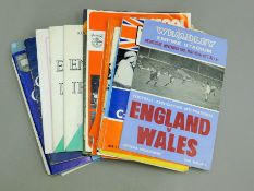 Ten Arsenal Football programmes, other football programmes and rugby programmes.