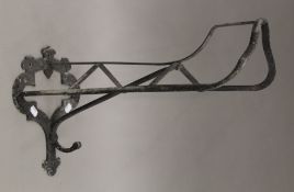 A cast iron saddle rack. 54 cm long.