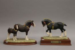 Two Border Fine Arts shire horse models, each mounted on a wooden plinth base. The largest 26.