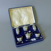 A boxed Mappin & Webb silver cruet set, spoons associated (one plated). 257.7 grammes silver weight.