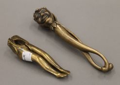 A vintage brass jester nutcracker and another. The former 18 cm high.