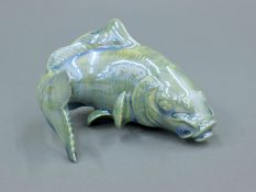 A Royal Worcester lustre glazed porcelain model of a fish. 9.5 cm long.