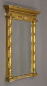 A Regency giltwood and composition pier glass. 53 cm wide.