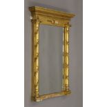 A Regency giltwood and composition pier glass. 53 cm wide.