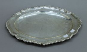 A Victorian silver serving plate. 42 cm long. 51.2 troy ounces.