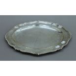 A Victorian silver serving plate. 42 cm long. 51.2 troy ounces.