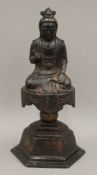 A Chinese bronze Buddha with traces of gilding. 29 cm high.