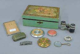 A box of various items, including a silver photograph, a silver compact, opera glasses, etc.