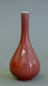 A small Chinese porcelain straight necked vase. 15 cm high.
