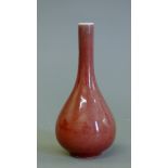 A small Chinese porcelain straight necked vase. 15 cm high.